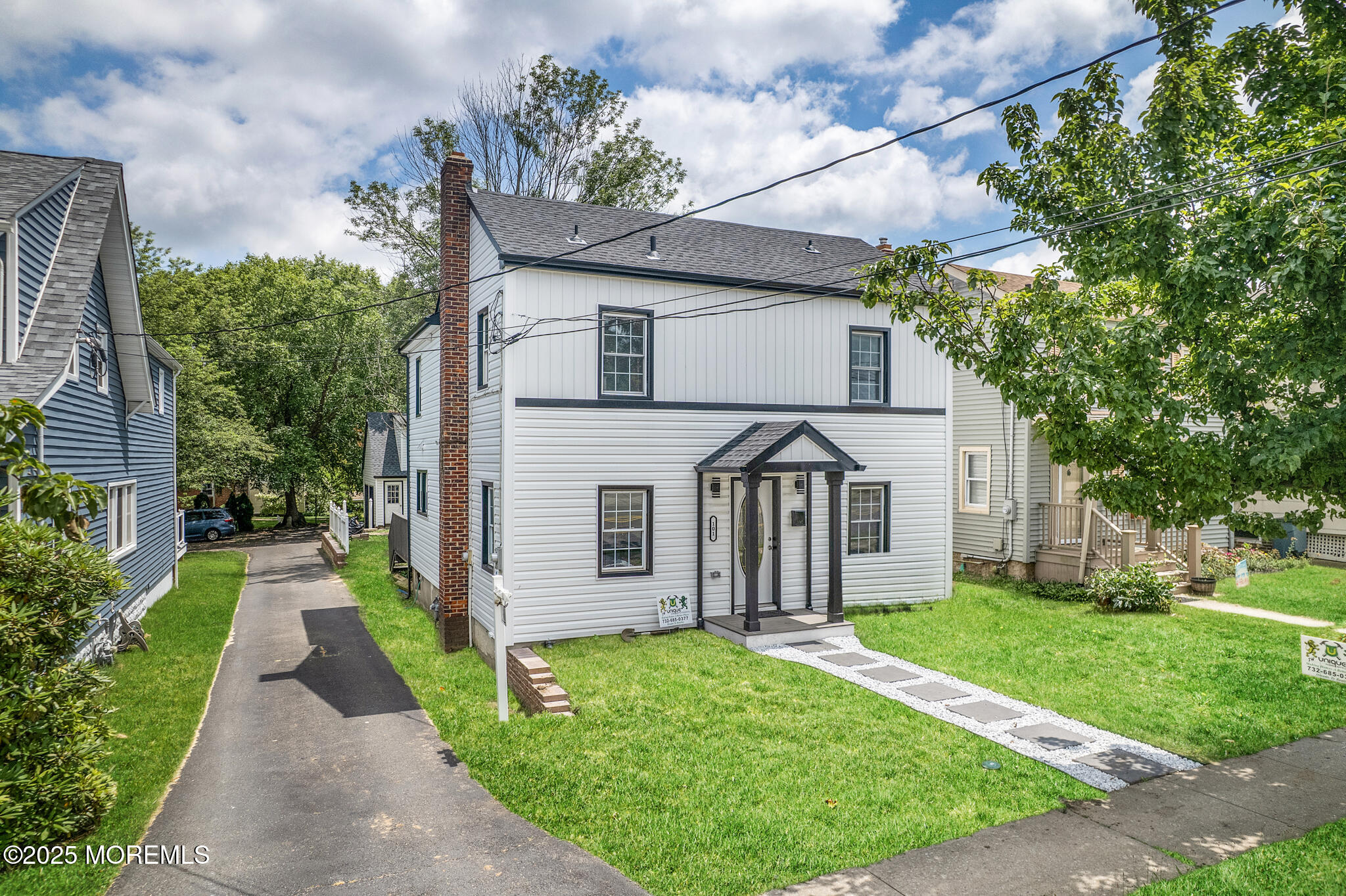 101 Broad Street Matawan, NJ 07747 - Photo 25 of 44 a front view of a house with garden