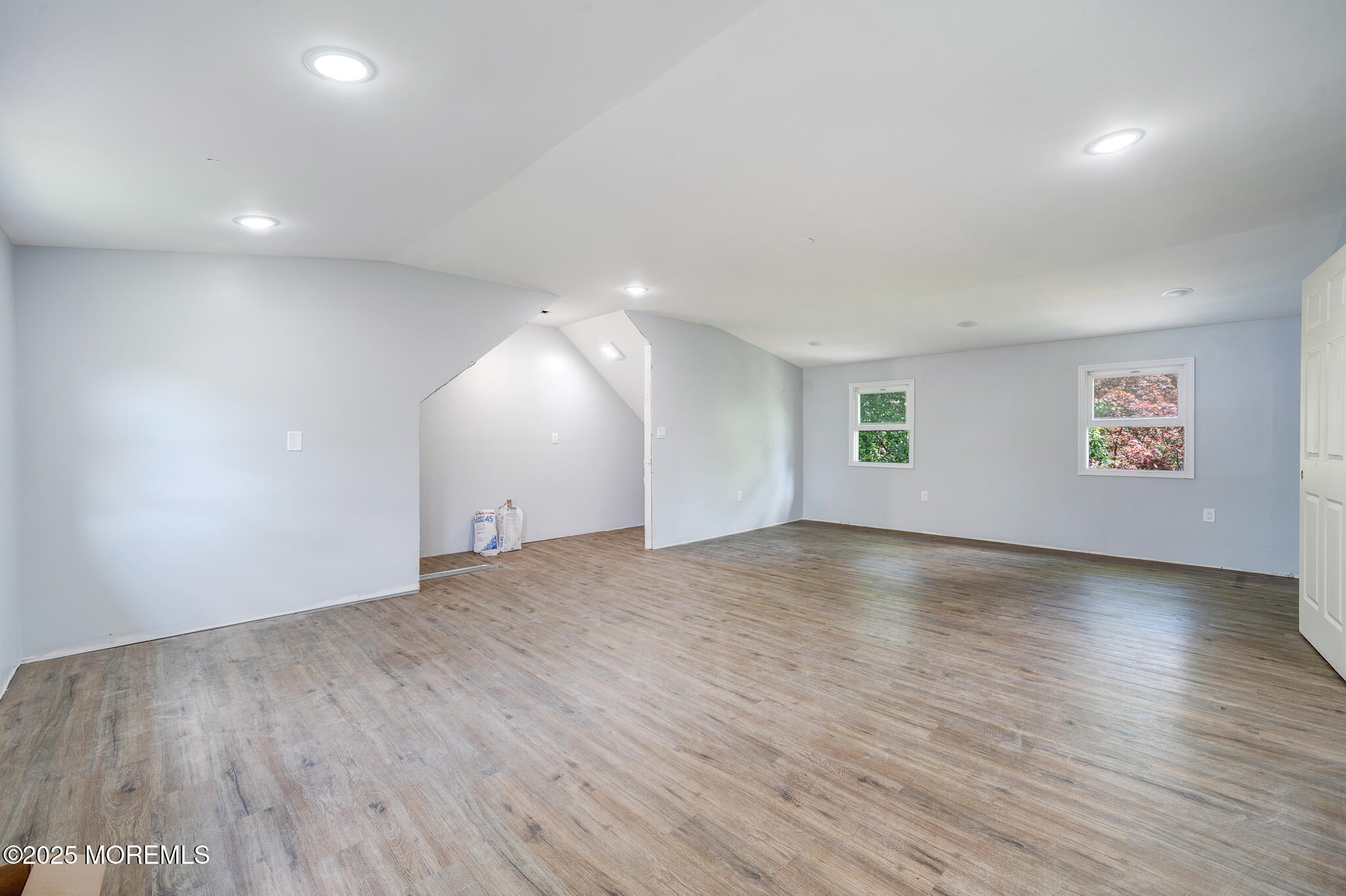 101 Broad Street Matawan, NJ 07747 - Photo 26 of 44 an empty room with wooden floor and windows