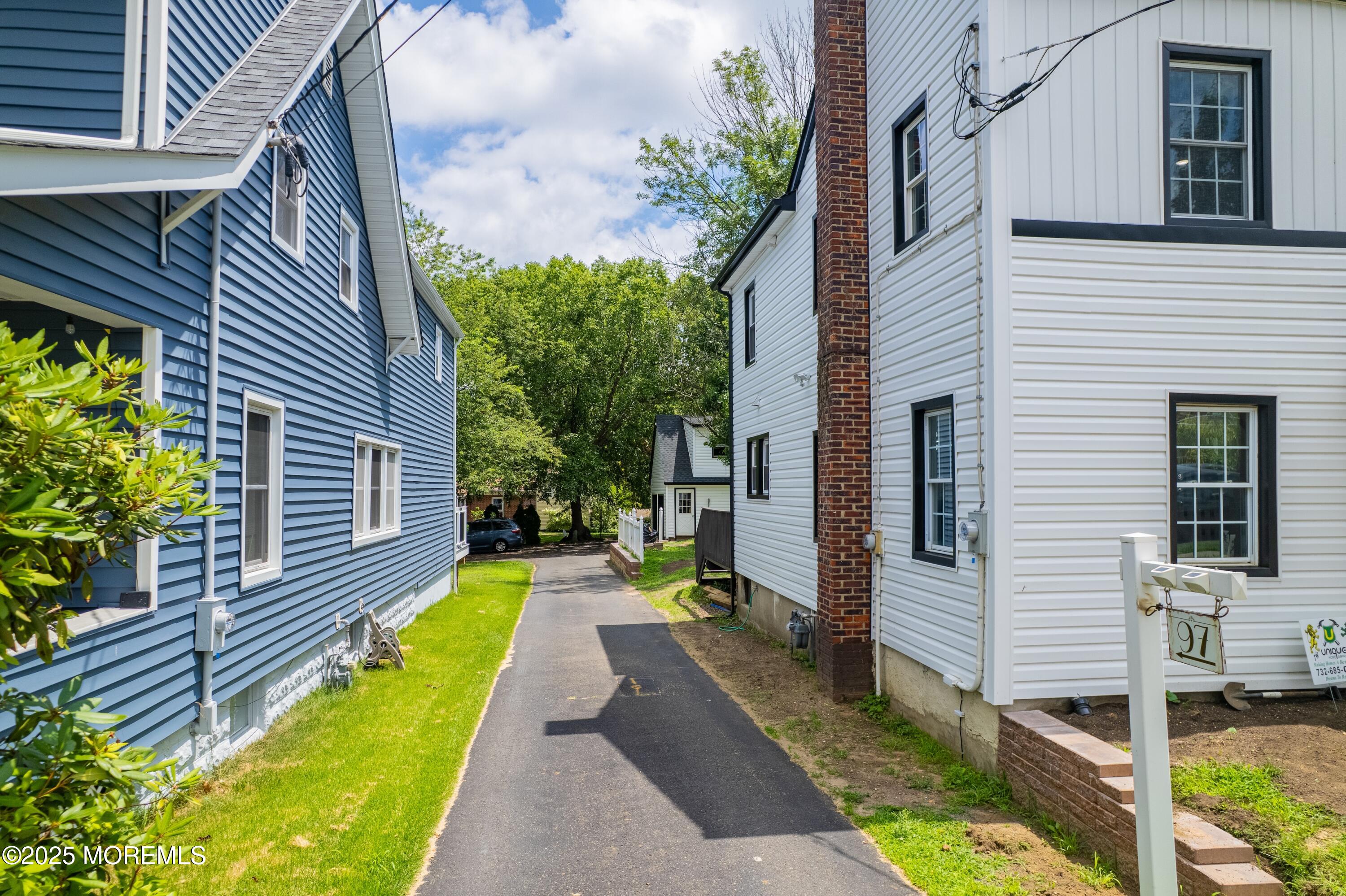 101 Broad Street Matawan, NJ 07747 - Photo 28 of 44 a view of a house with a small yard and wooden fence