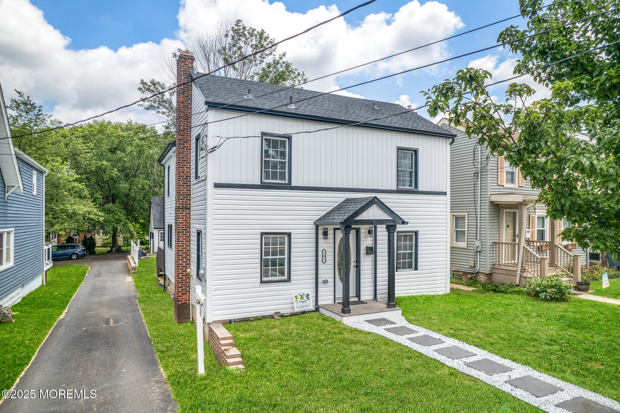 101 Broad Street Matawan, NJ 07747 - Photo 30 of 44 a front view of a house with a yard and trees