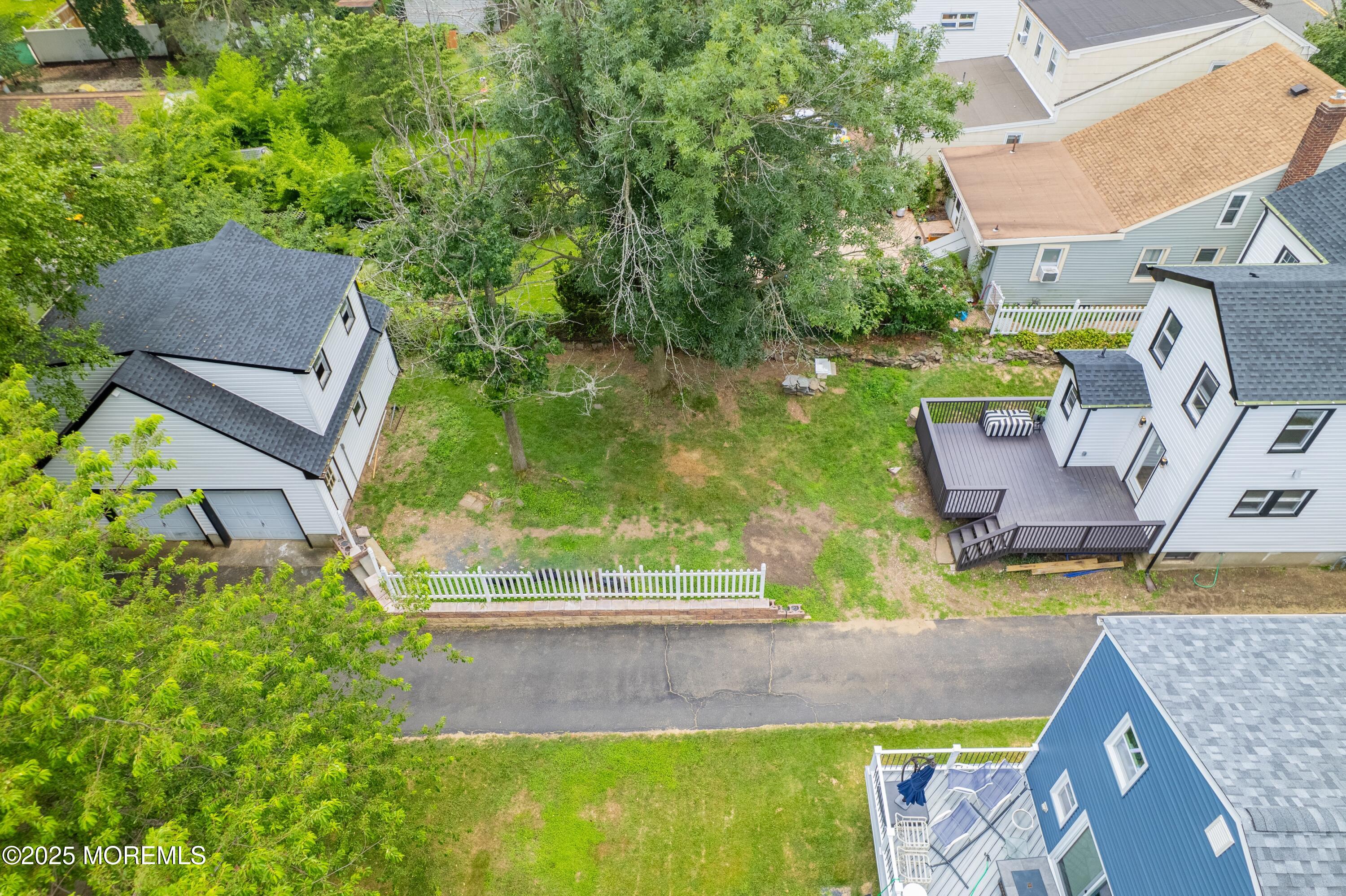 101 Broad Street Matawan, NJ 07747 - Photo 32 of 44 an aerial view of a house with swimming pool and garden