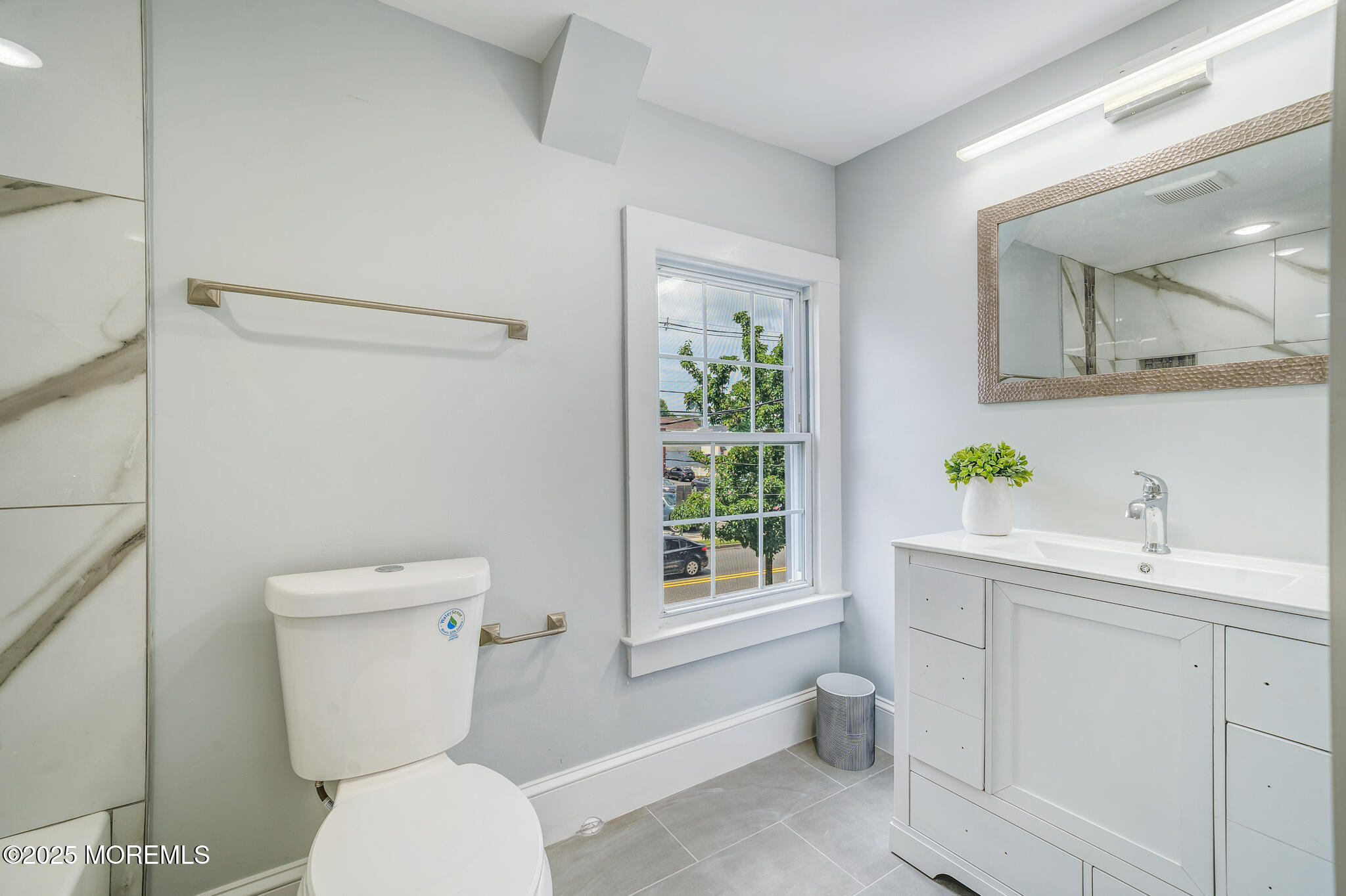 101 Broad Street Matawan, NJ 07747 - Photo 33 of 44 a white toilet sitting next to a bathroom sink