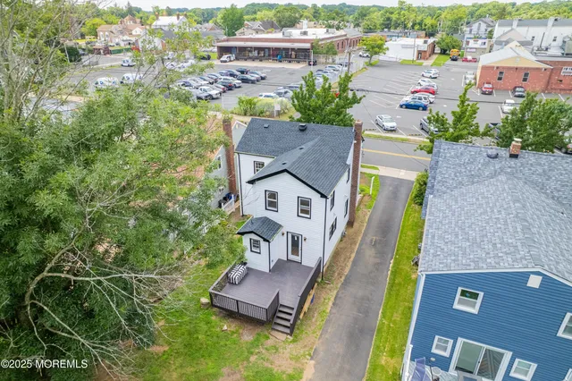an aerial view of a house with a garden