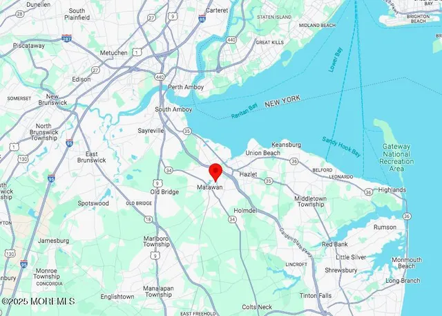 a white and yellow umbrella sitting in a bedroom