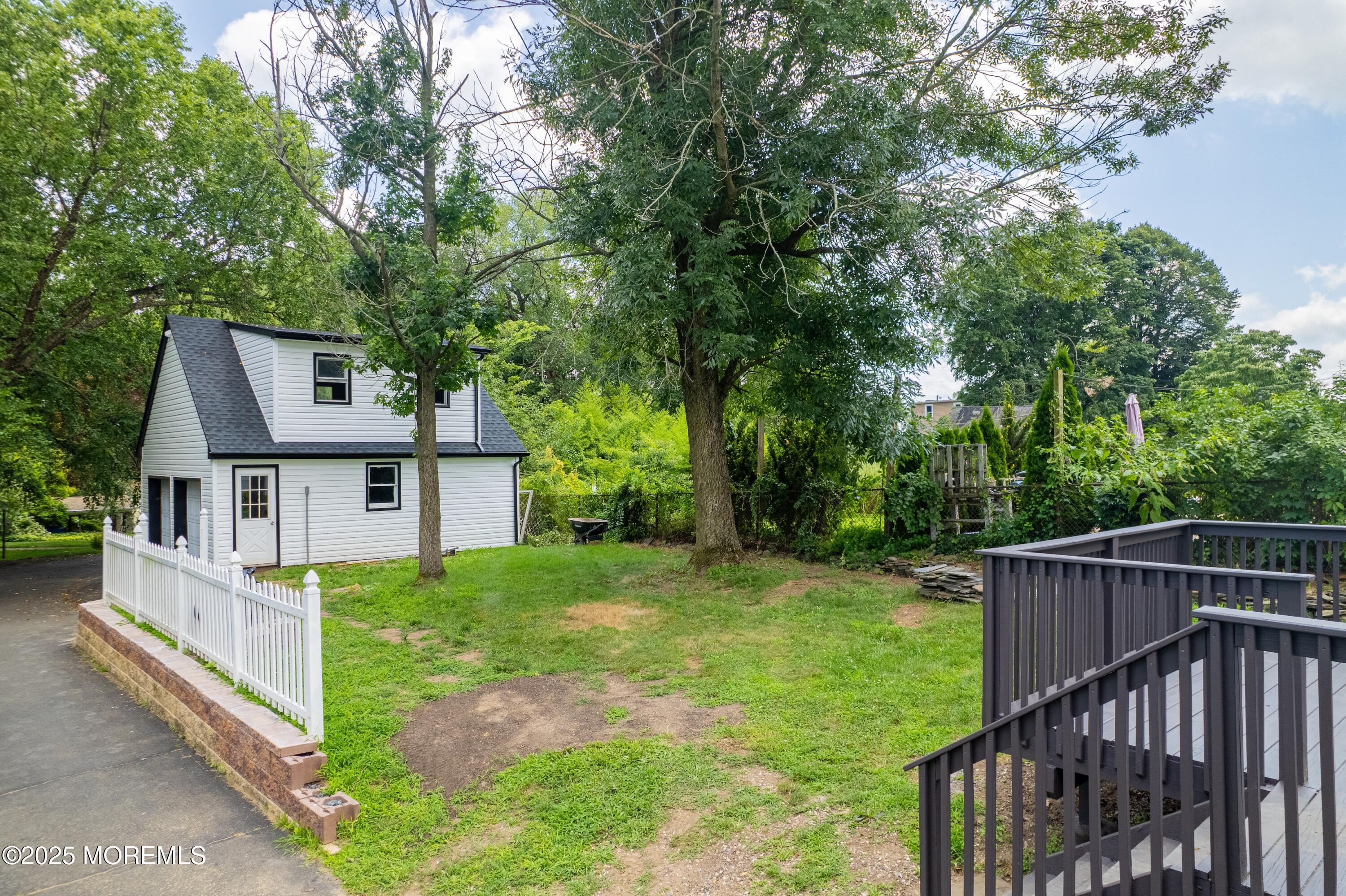 101 Broad Street Matawan, NJ 07747 - Photo 4 of 44 a view of a house with backyard and trees