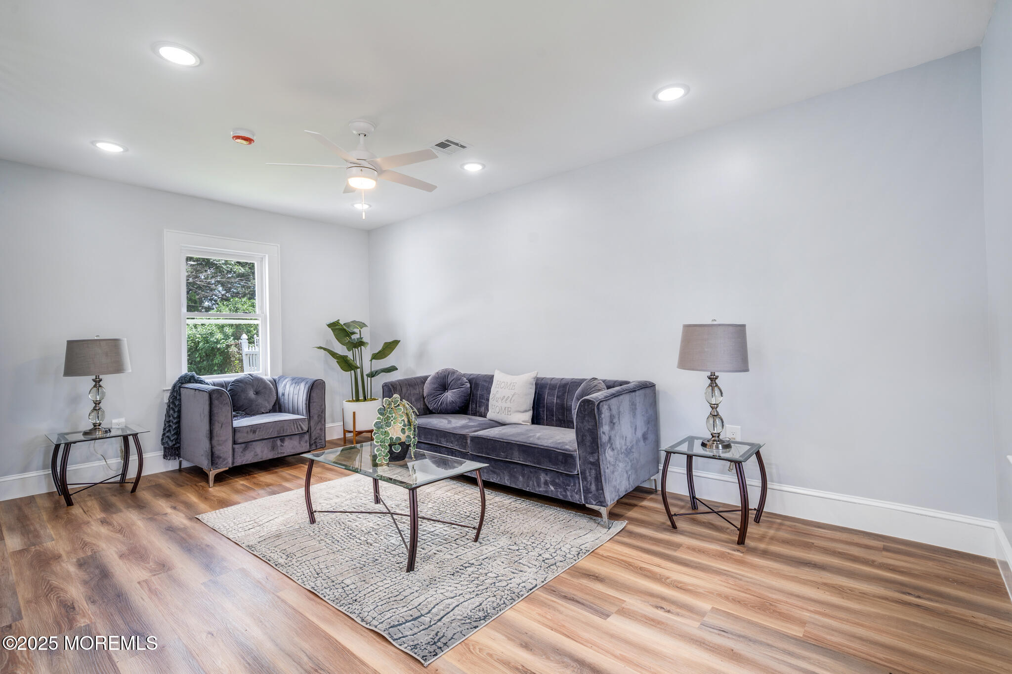 101 Broad Street Matawan, NJ 07747 - Photo 6 of 44 a living room with furniture and a wooden floor