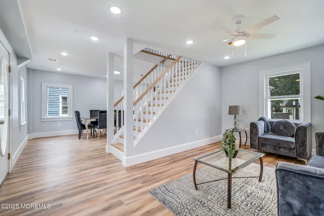 a living room with furniture and a table