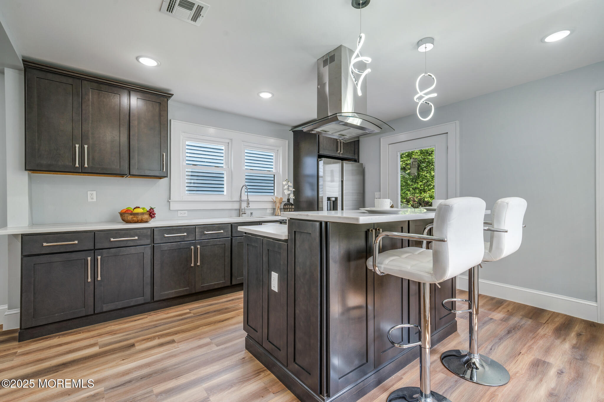101 Broad Street Matawan, NJ 07747 - Photo 10 of 44 a kitchen with granite countertop a sink cabinets and wooden floor