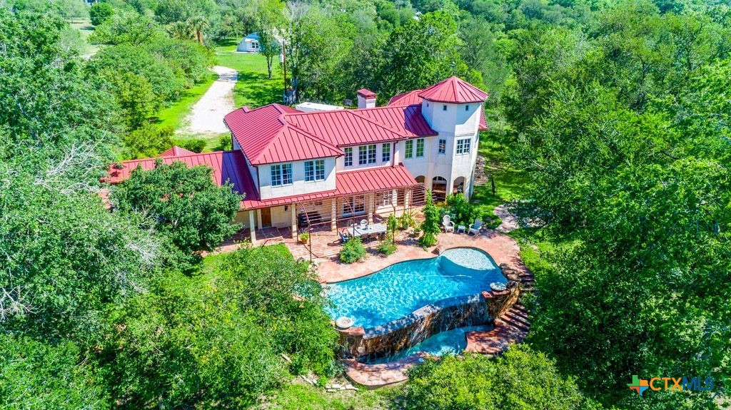 541 Martindale Falls Road Martindale, TX 78655 - Photo 3 of 44 an aerial view of a house with swimming pool a yard and lake view