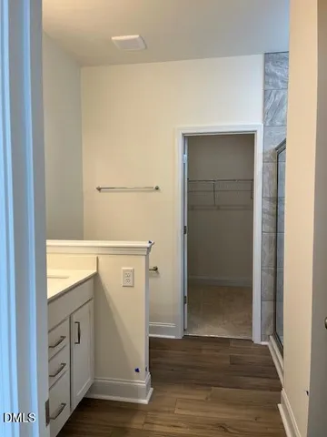 a view of an entryway with wooden floor