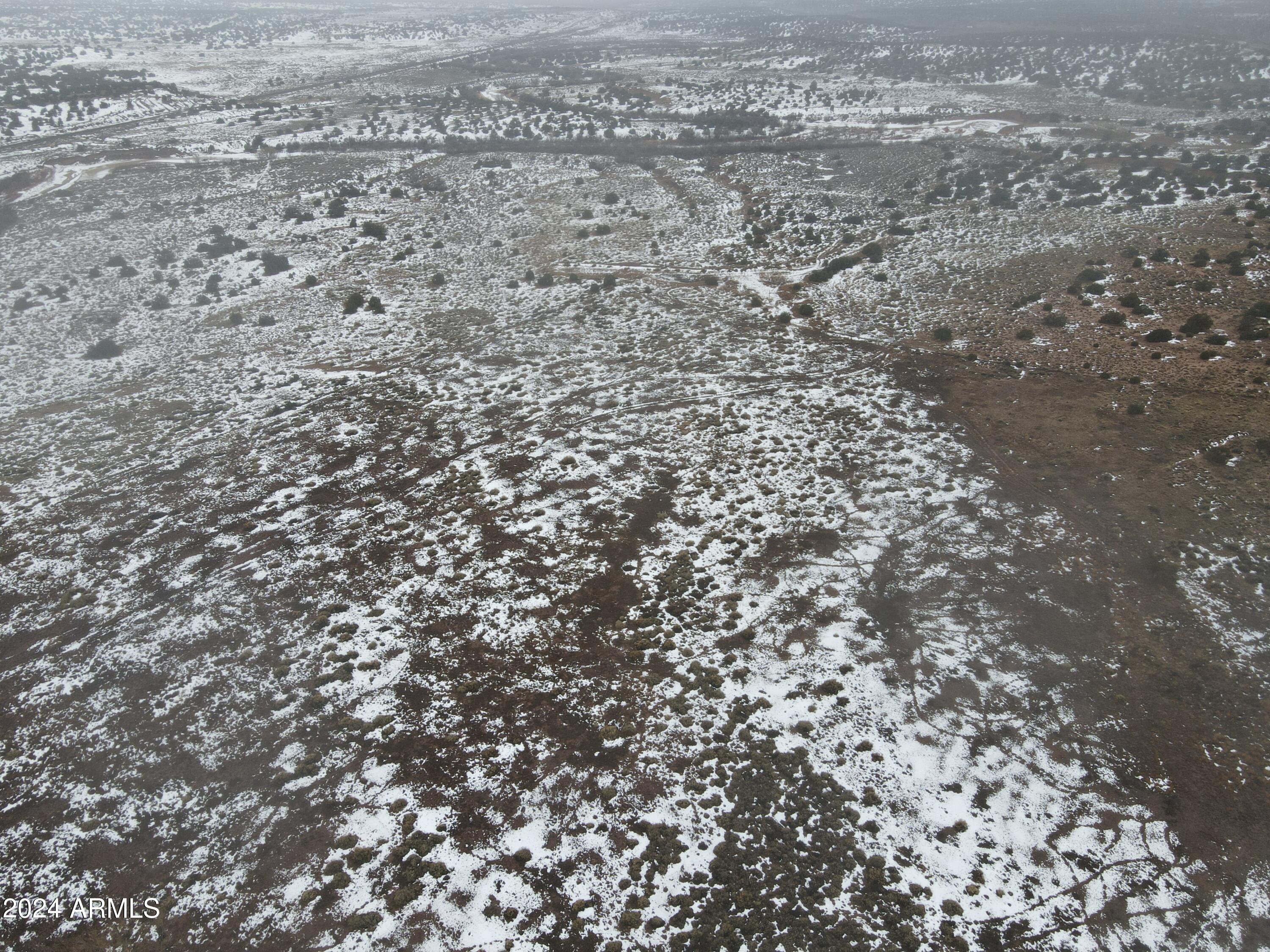 346 West Rd Houck Az 86506 Road Houck, AZ 86506 - Photo 13 of 42 a view of a dry yard with wooden floor