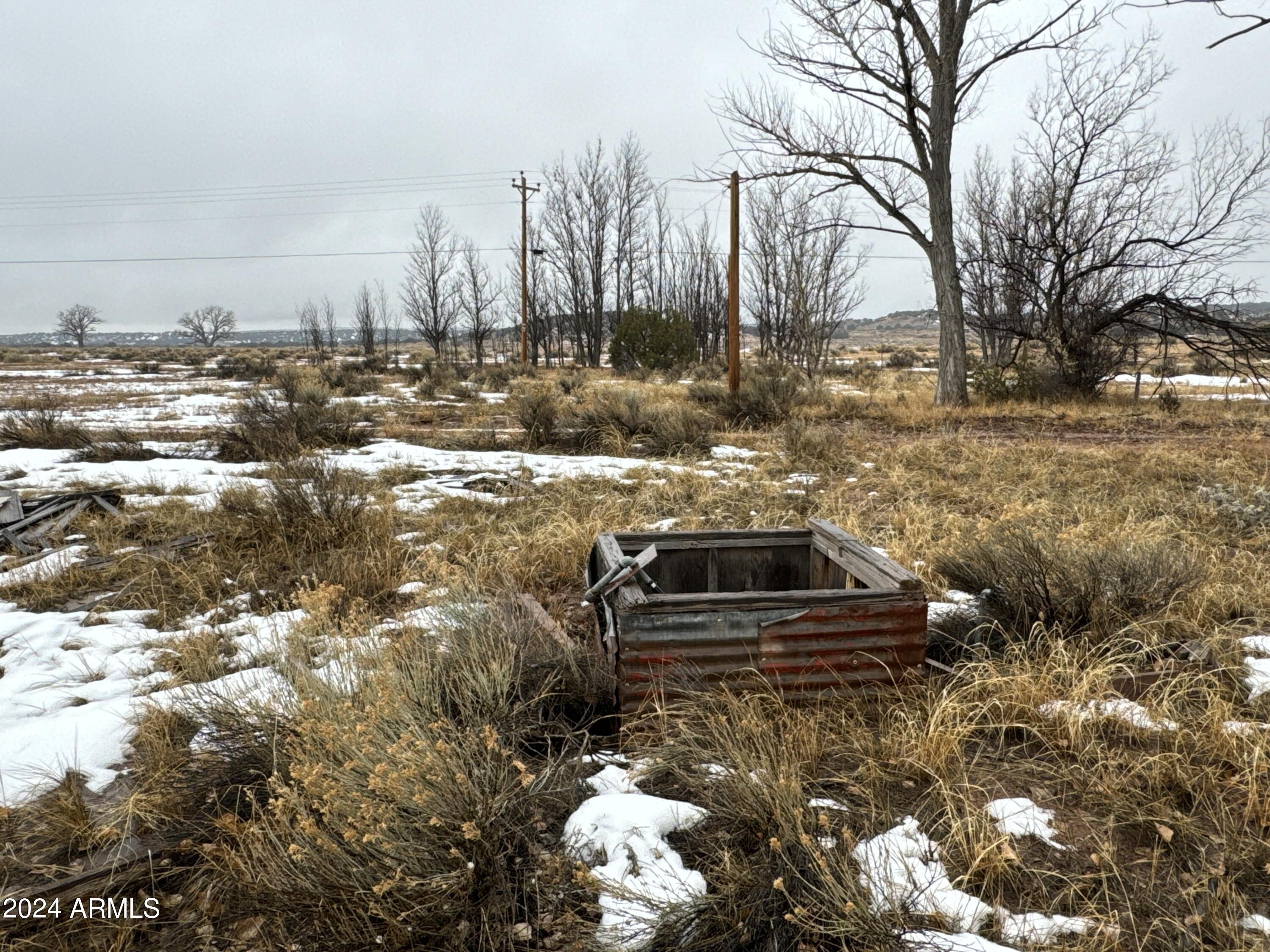 346 West Rd Houck Az 86506 Road Houck, AZ 86506 - Photo 29 of 42 a front view of a house with a yard covered with snow