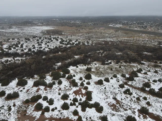 a view of a dry yard with wooden floor