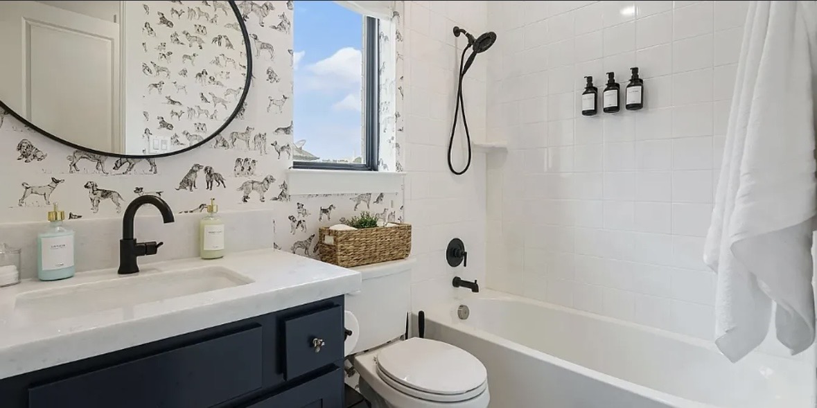 109 Arrowhead Mound Road Georgetown, TX 78628 - Photo 13 of 27 A well-appointed bathroom with a spacious vanity, sleek fixtures, and an inviting bathtub.