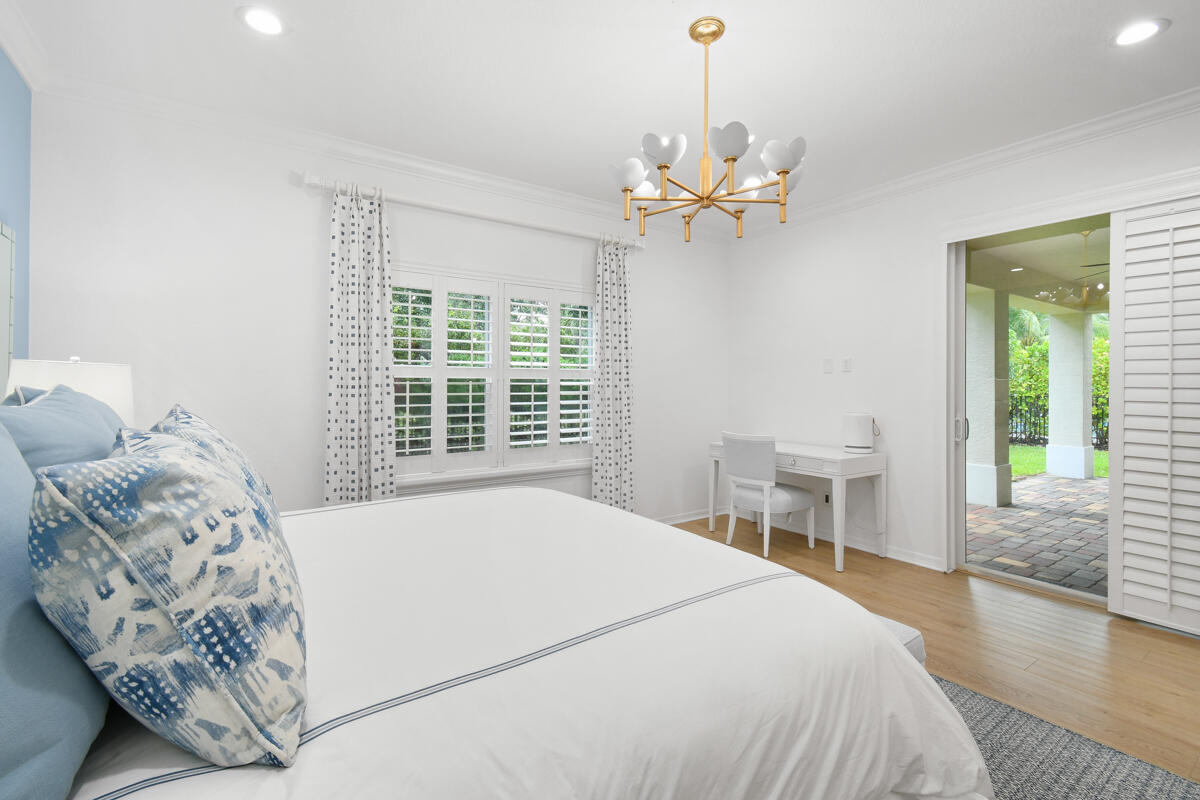 193 Porgee Rock Place Jupiter, FL 33458 - Photo 22 of 76 a bedroom with a large bed and a window