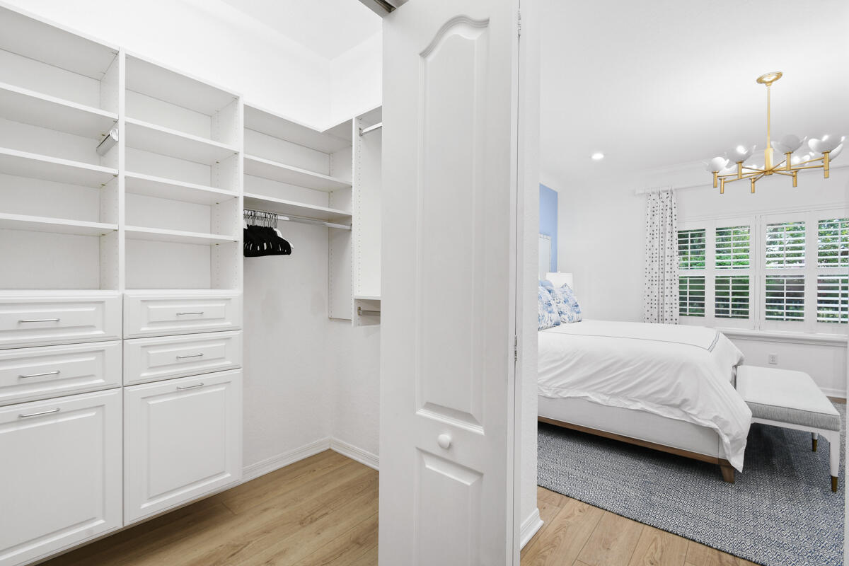 193 Porgee Rock Place Jupiter, FL 33458 - Photo 25 of 76 a bedroom with a bed and a window