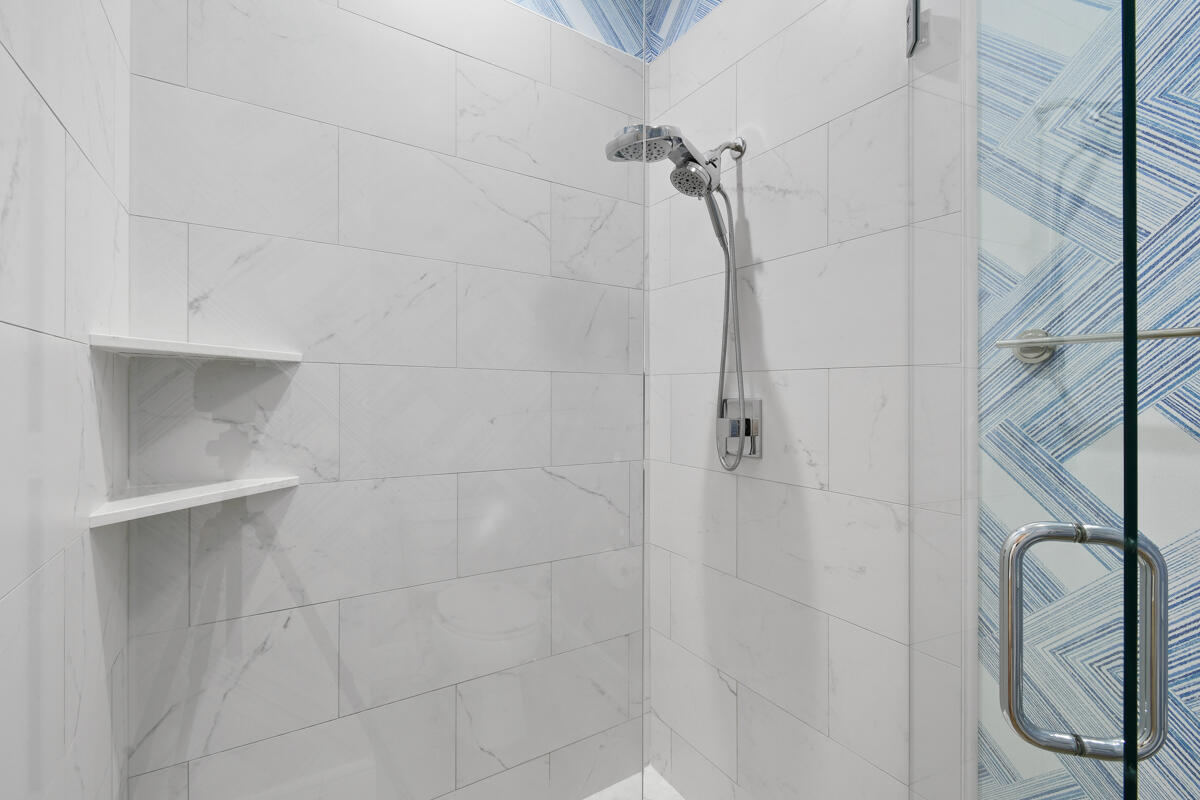 193 Porgee Rock Place Jupiter, FL 33458 - Photo 33 of 76 a bathroom with a shower