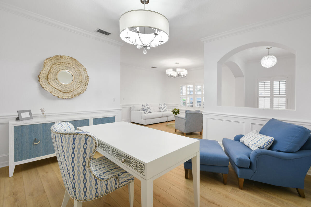 193 Porgee Rock Place Jupiter, FL 33458 - Photo 9 of 76 a view of a dining room with furniture and wooden floor