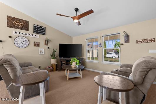 552 Spur Court Fernley, NV 89408 - Photo 8 of 46 a living room with furniture and a flat screen tv