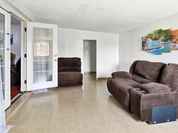 a living room with furniture and a window