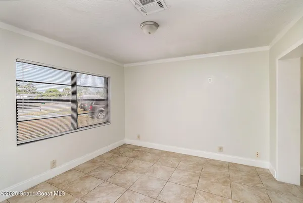 an empty room with a empty space and window