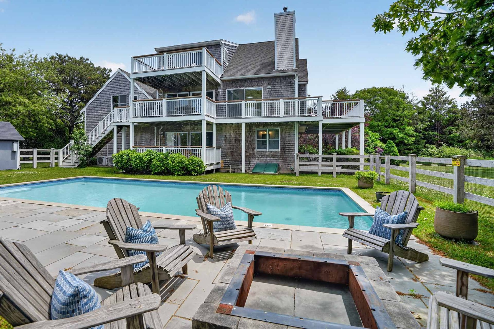 9 Thaxter Lane Edgartown, MA 02539 - Photo 2 of 53 a view of a swimming pool with lawn chairs and a yard