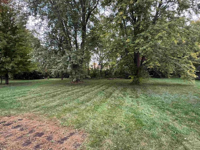 a view of outdoor space with deck and yard