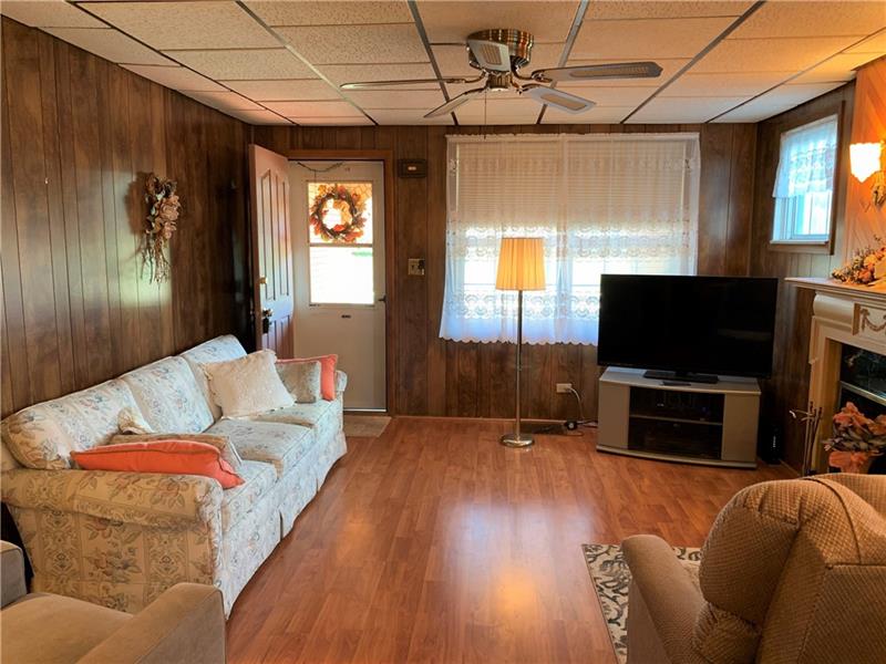 411 Ridge Avenue Canonsburg, PA 15317 - Photo 3 of 17 Living room - looking in from the dining room. Beautiful laminate floors. Room measures 13x15