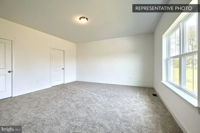 a view of an empty room and window