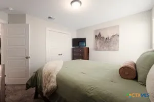 a bedroom with a bed and a couch