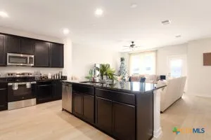 a kitchen with granite countertop lots of counter top space