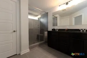a bathroom with a sink and a mirror