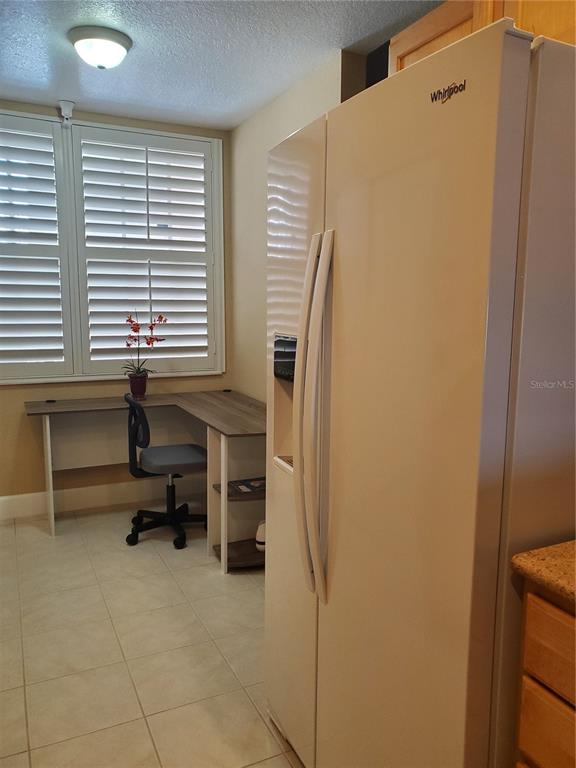 13413 Gasparilla Road, Unit 304 Placida, FL 33946 - Photo 20 of 28 a room that has a chair and a window
