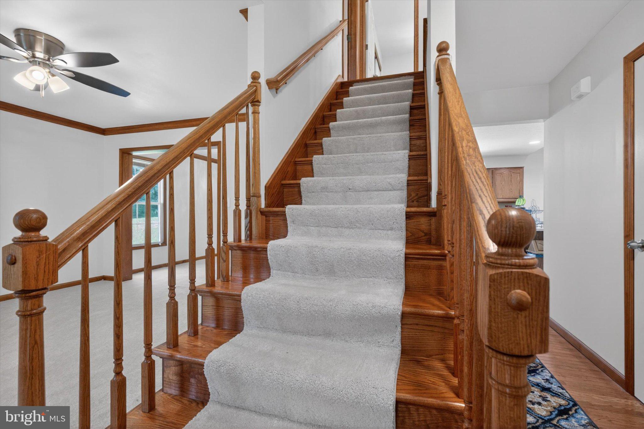 802 Hollow Road Delta, PA 17314 - Photo 17 of 45 Inviting staircase with warm wood accents.