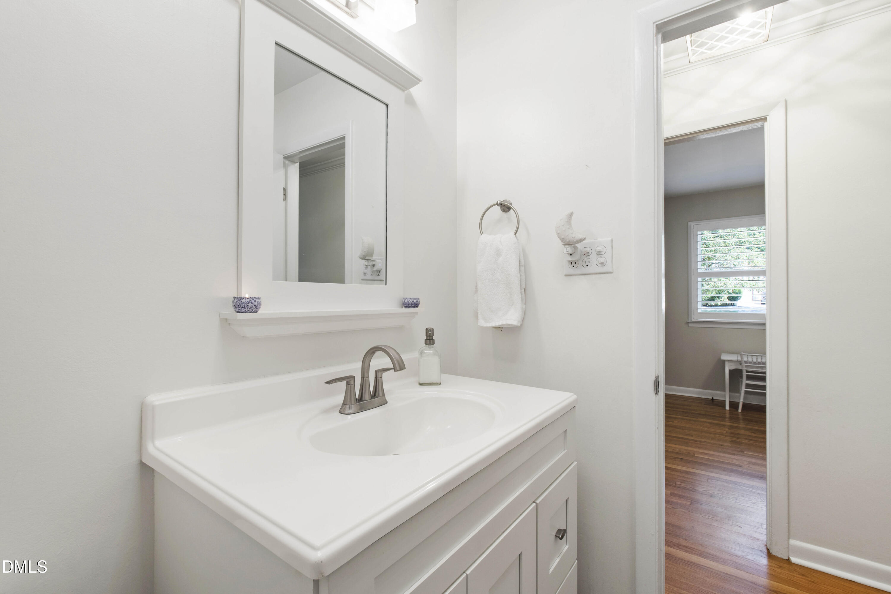 304 Latimer Road Raleigh, NC 27609 - Photo 11 of 42 a bathroom with a sink and a mirror