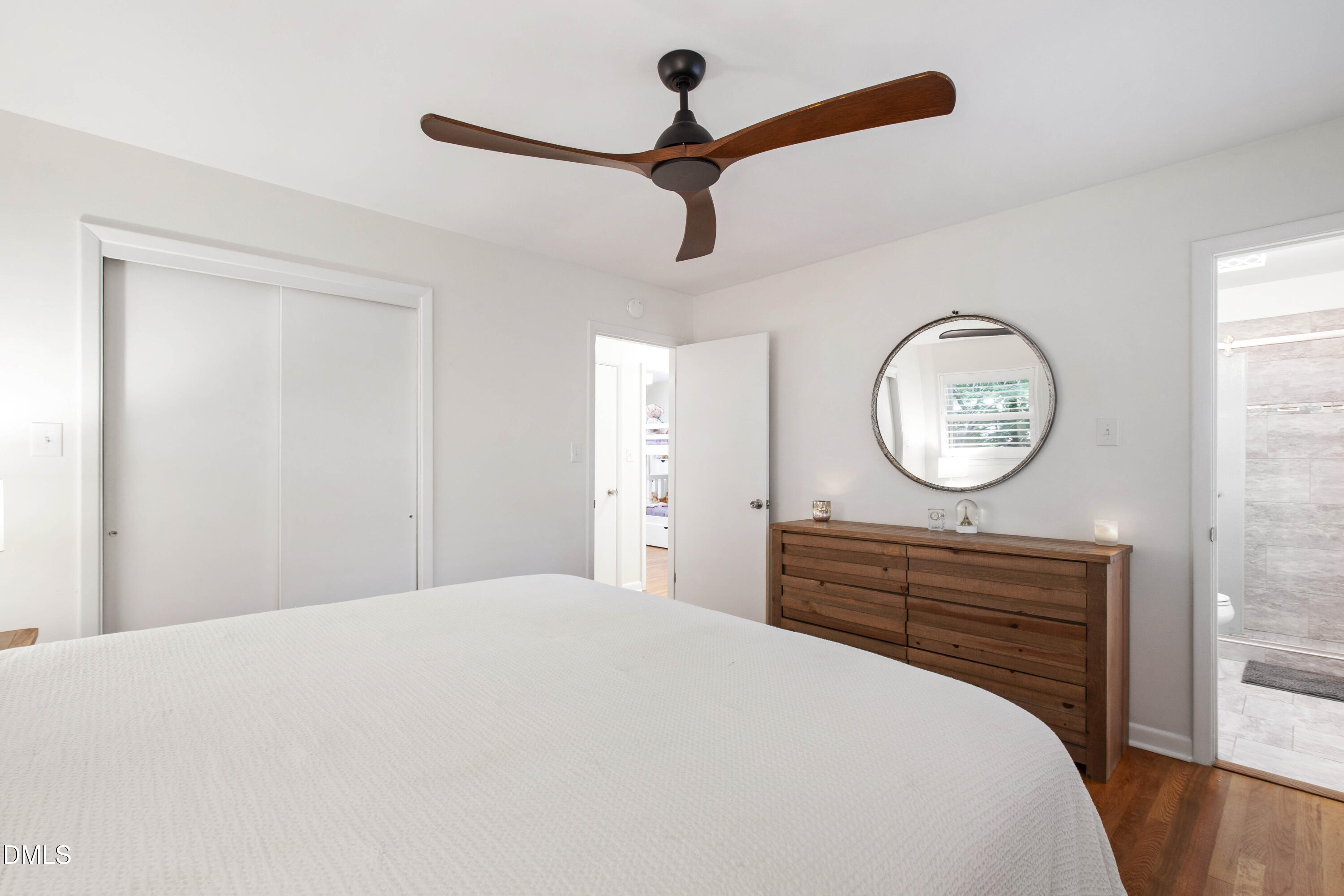 304 Latimer Road Raleigh, NC 27609 - Photo 14 of 42 a bedroom with a bed and a chandelier