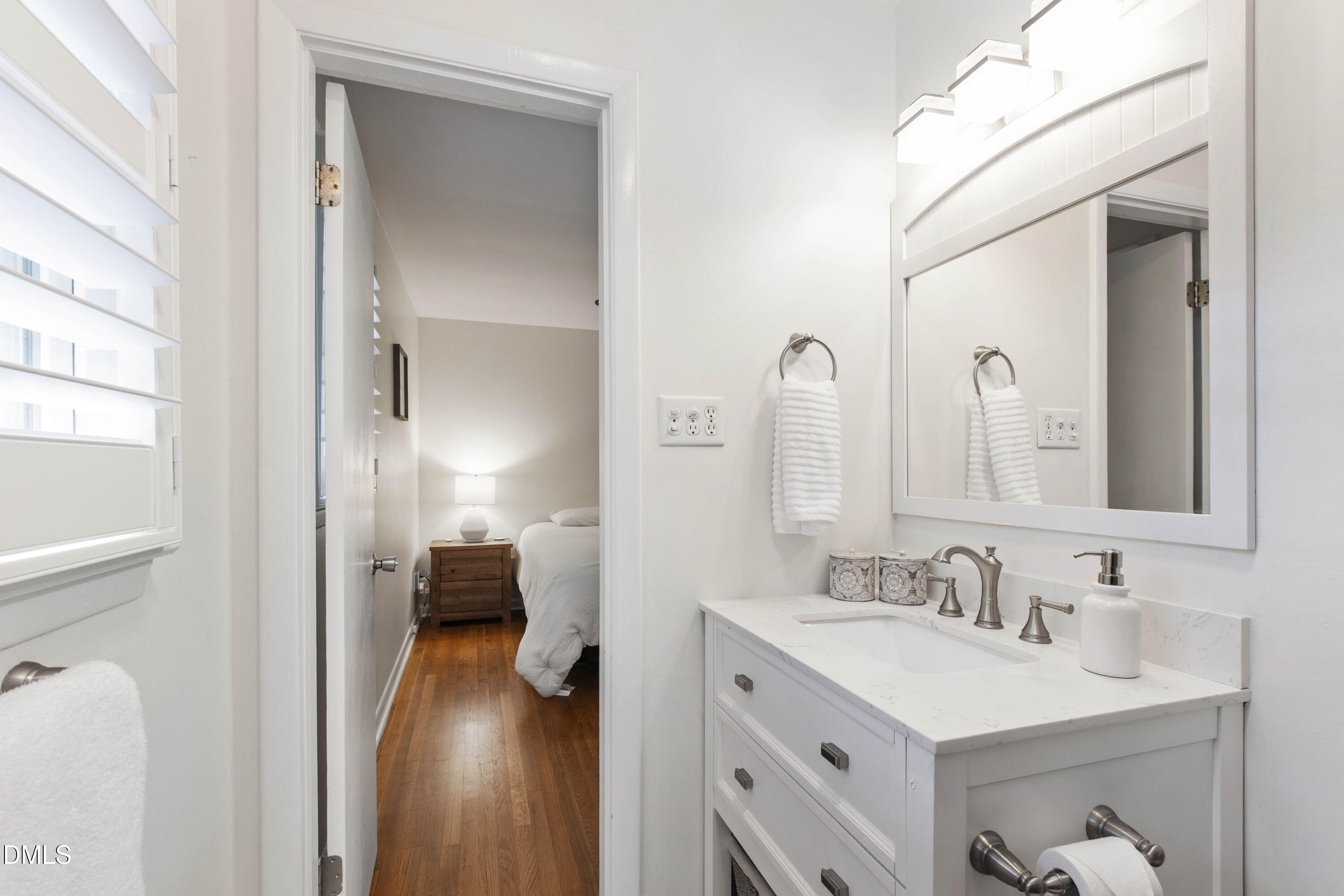304 Latimer Road Raleigh, NC 27609 - Photo 16 of 42 a en suite bathroom with a sink double vanity and a mirror