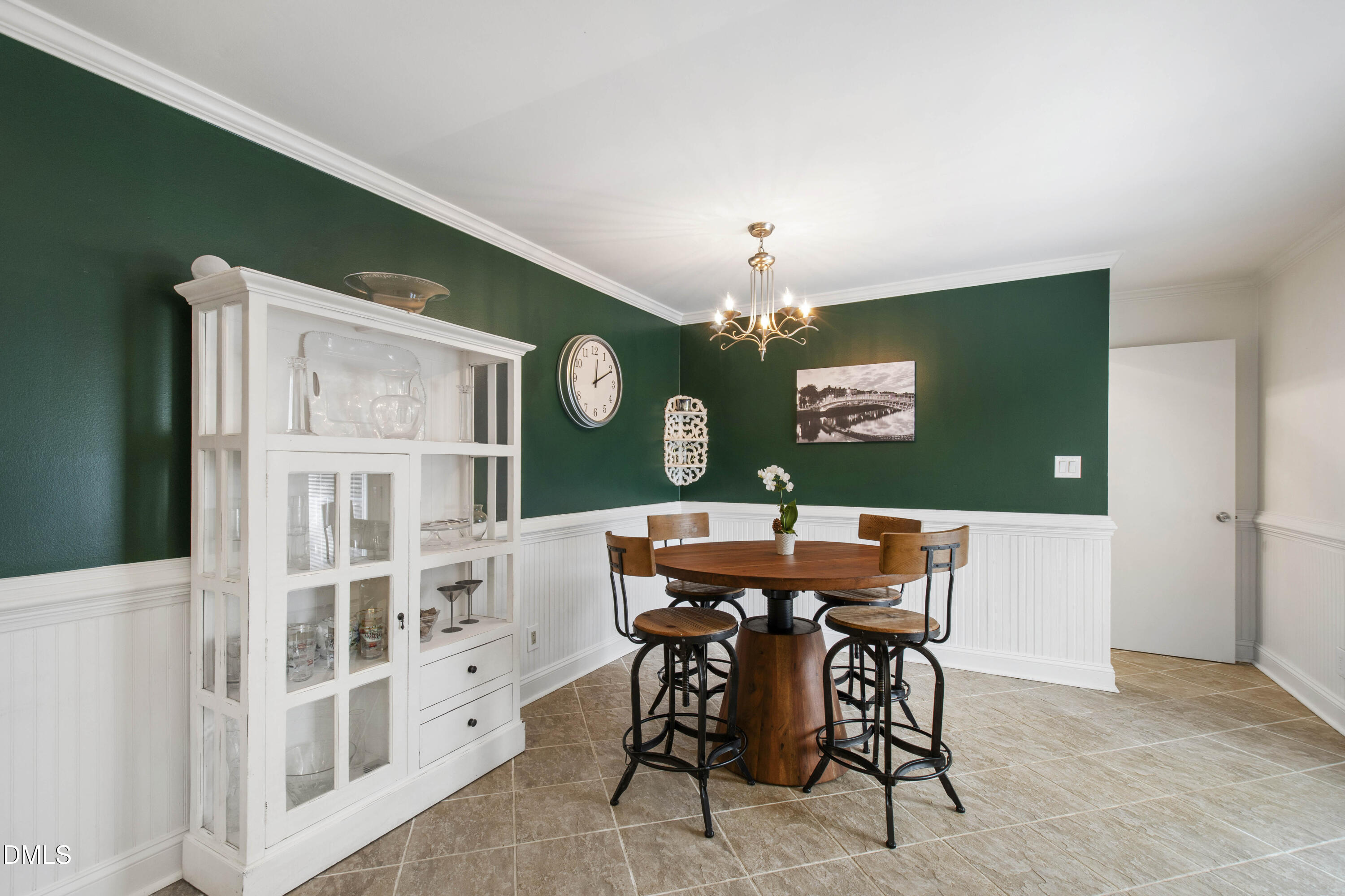 304 Latimer Road Raleigh, NC 27609 - Photo 21 of 42 a view of a dining room with furniture and chandelier