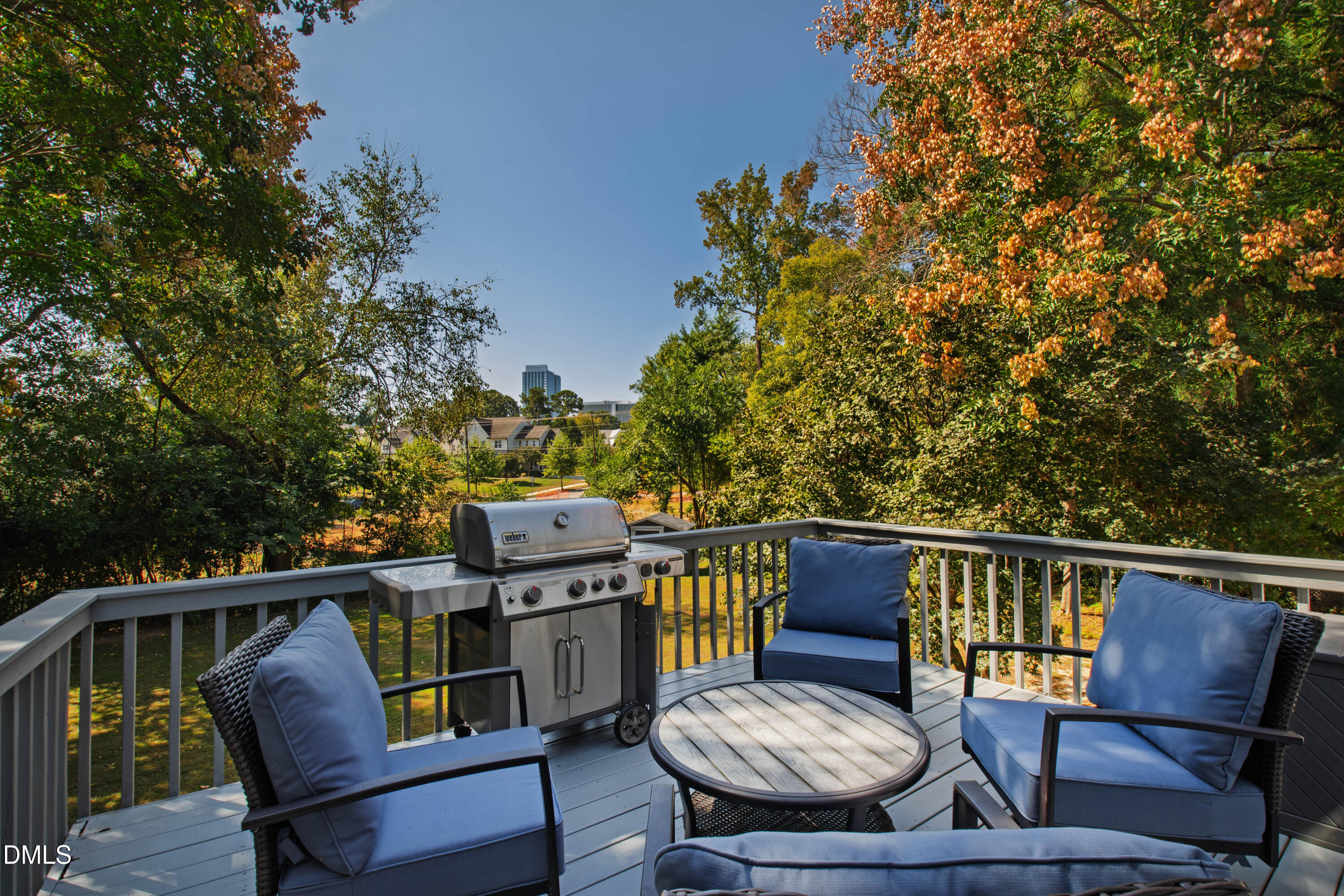 304 Latimer Road Raleigh, NC 27609 - Photo 24 of 42 a view of a chair and table on the deck
