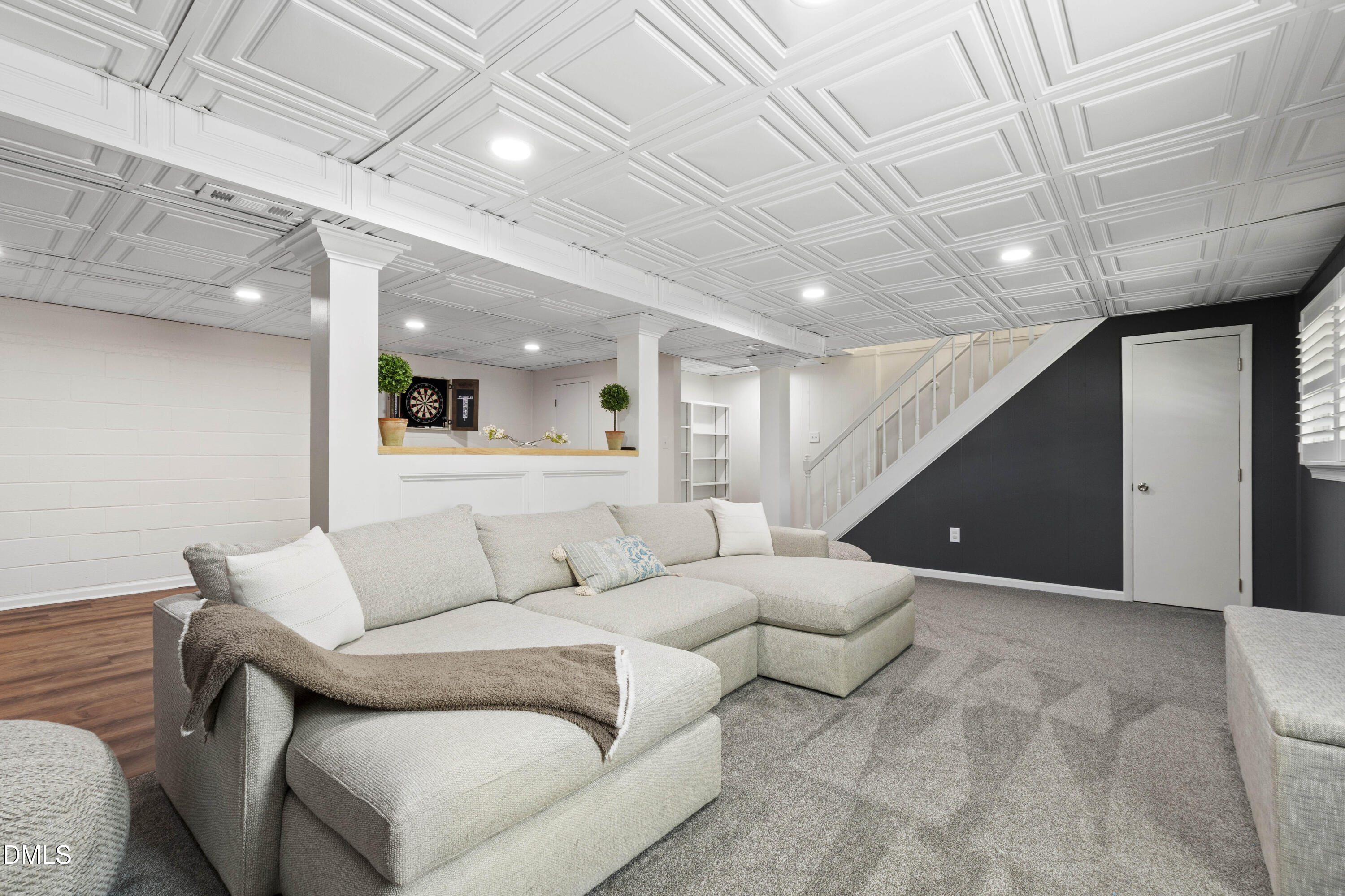 304 Latimer Road Raleigh, NC 27609 - Photo 29 of 42 a living room with furniture and a wooden floor