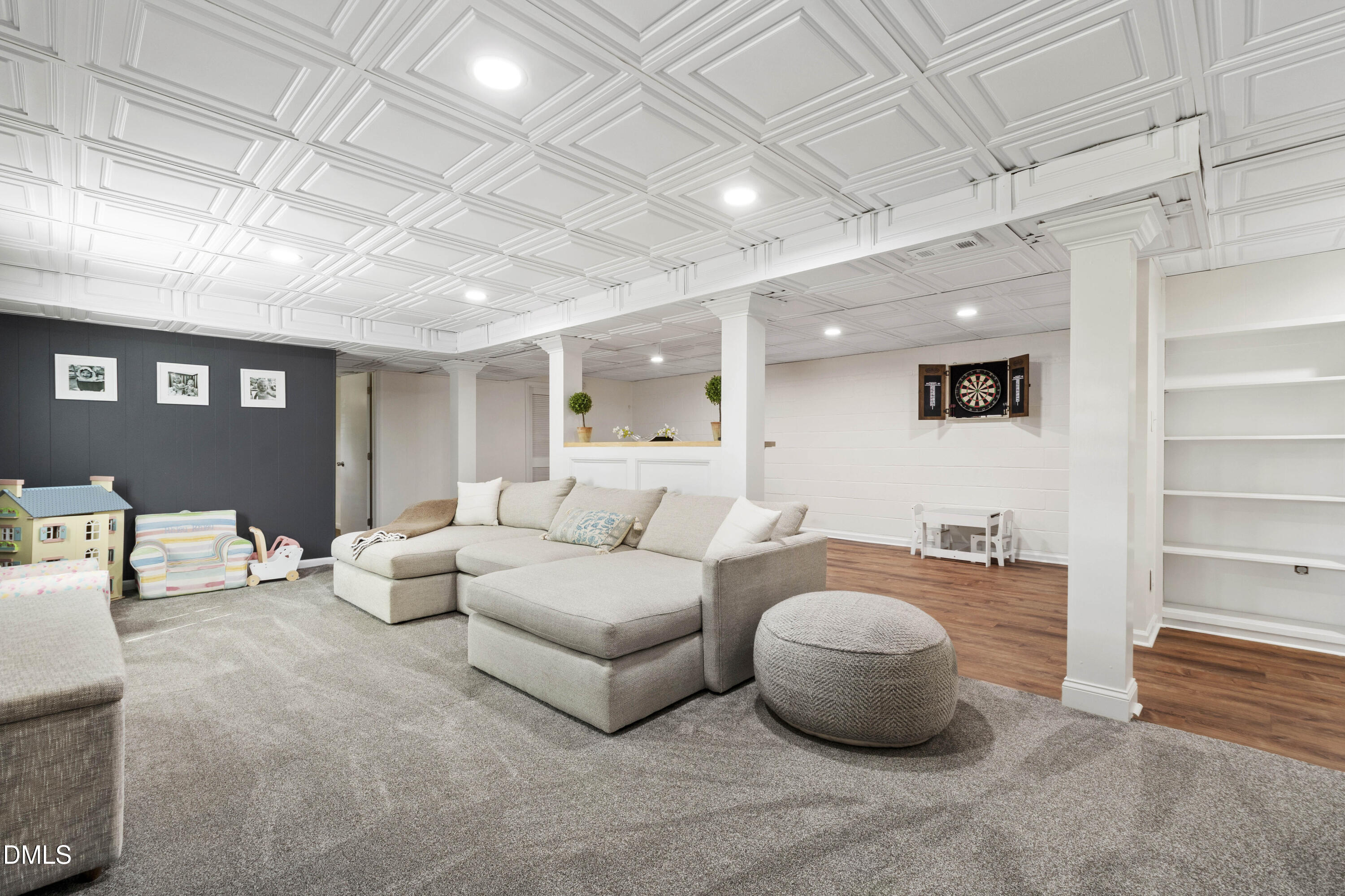 304 Latimer Road Raleigh, NC 27609 - Photo 30 of 42 a living room with furniture and a chandelier