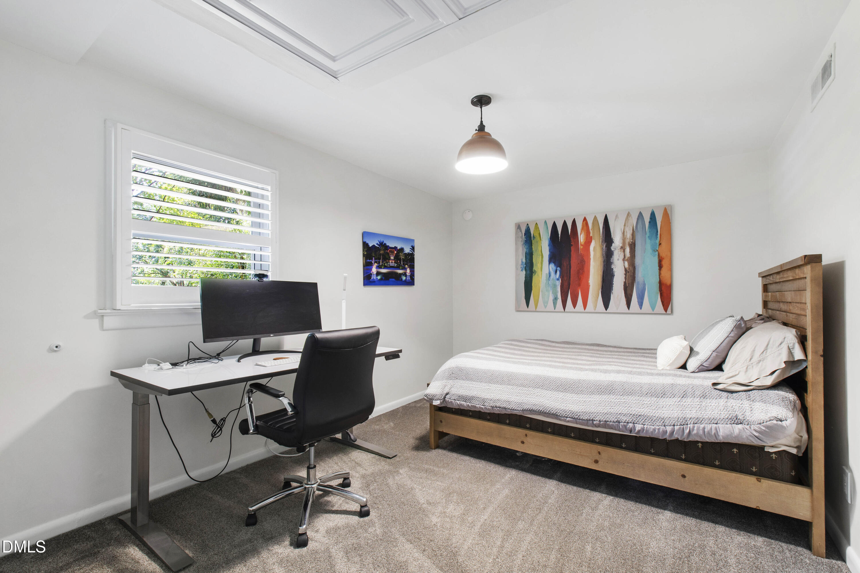 304 Latimer Road Raleigh, NC 27609 - Photo 31 of 42 a bedroom with a bed and a desk
