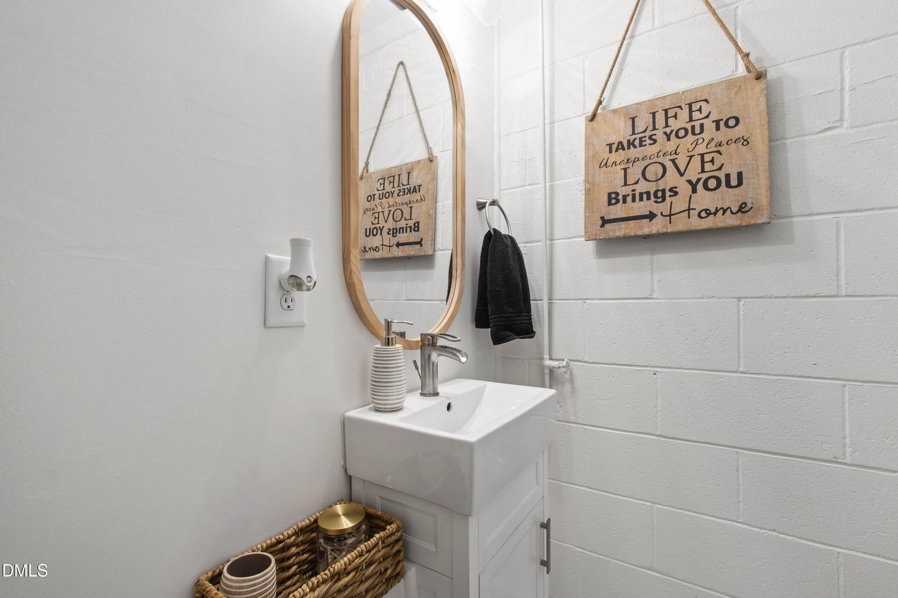 304 Latimer Road Raleigh, NC 27609 - Photo 33 of 42 a bathroom with a sink and a mirror