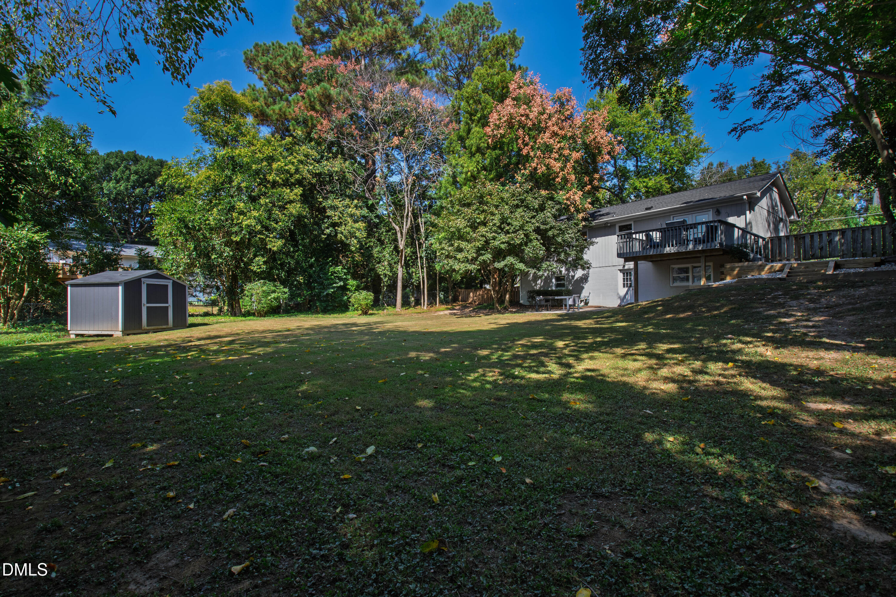 304 Latimer Road Raleigh, NC 27609 - Photo 39 of 42 a backyard of a house with lots of green space