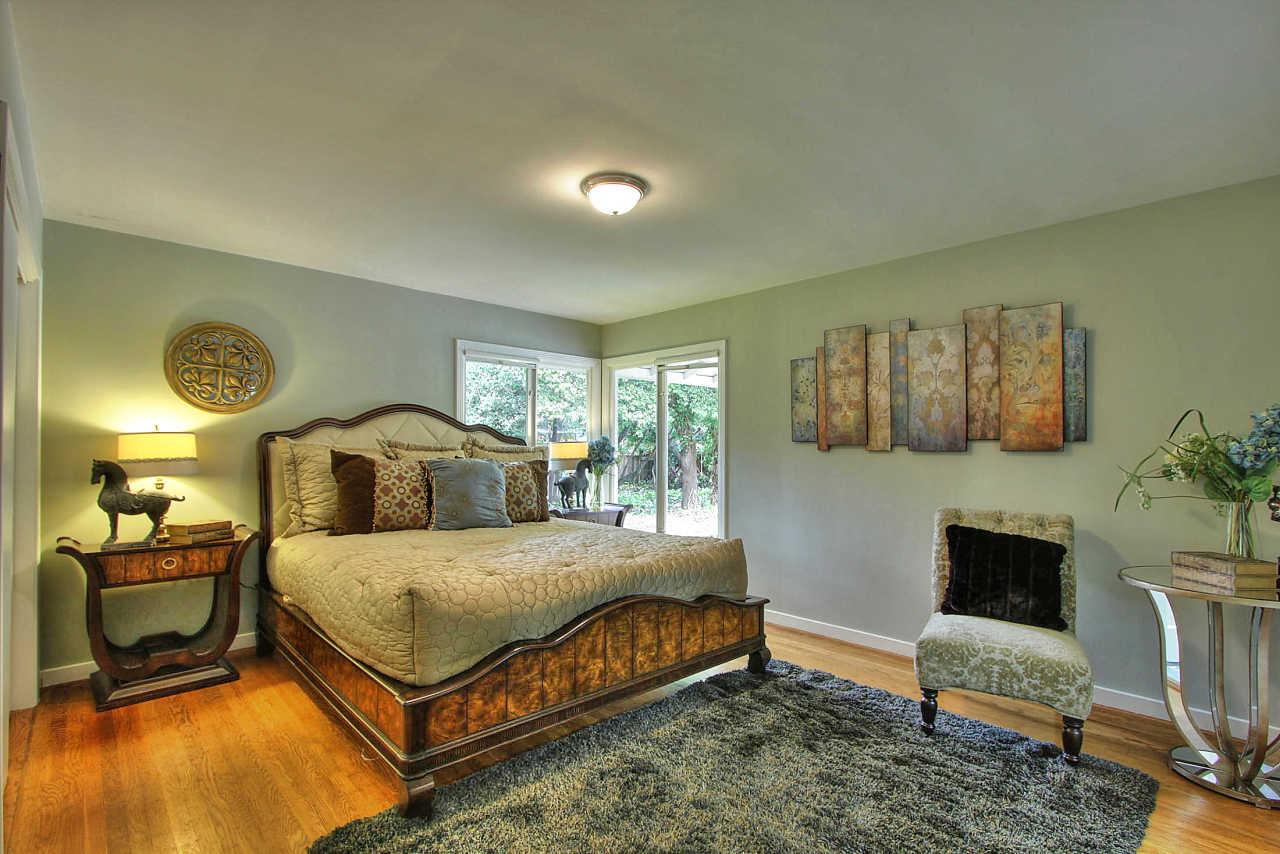 35 Selby Lane Atherton, CA 94027 - Photo 11 of 30 a bedroom with a bed a couch and dresser