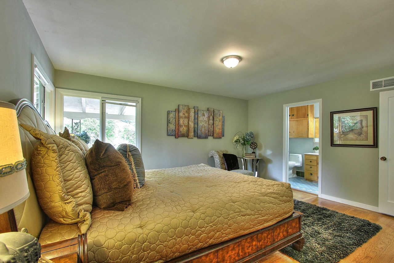 35 Selby Lane Atherton, CA 94027 - Photo 12 of 30 a bed sitting in a bedroom next to a window