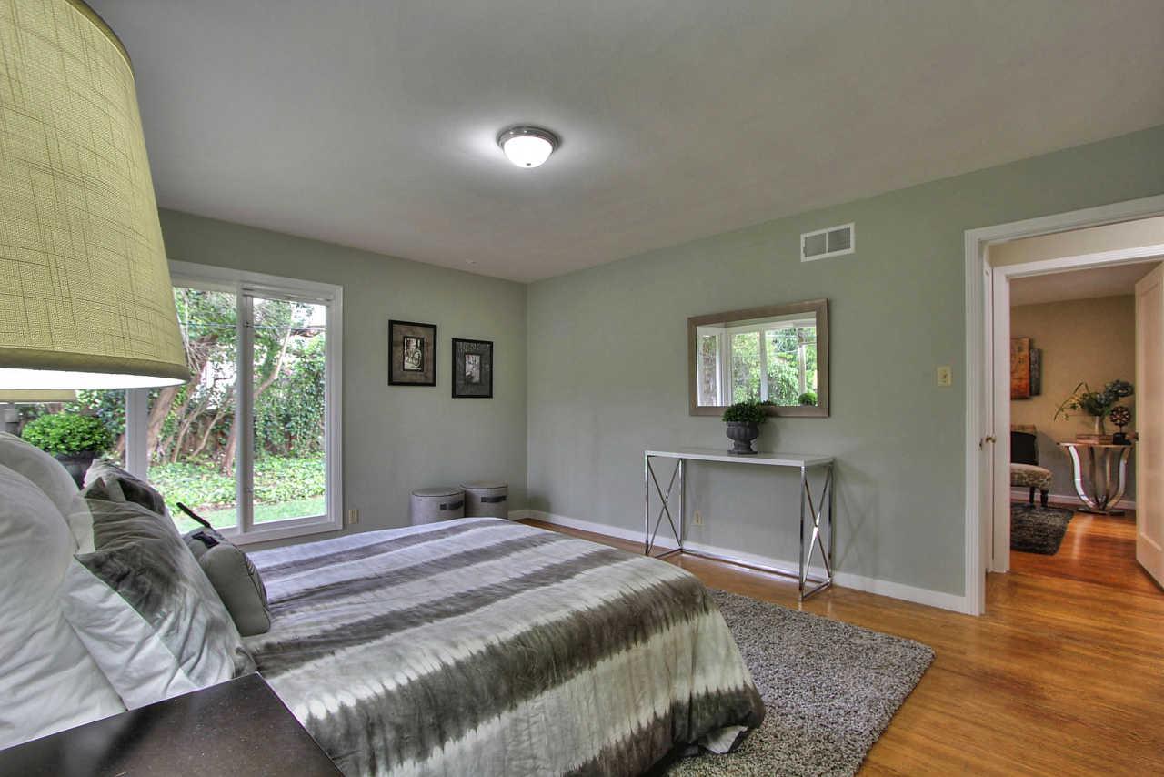 35 Selby Lane Atherton, CA 94027 - Photo 16 of 30 a bedroom with a bed and a table