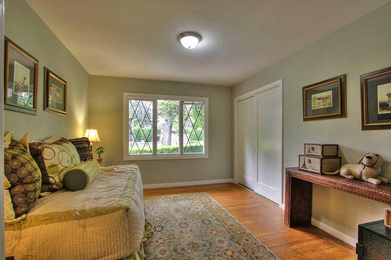 35 Selby Lane Atherton, CA 94027 - Photo 19 of 30 a bedroom with furniture and a window