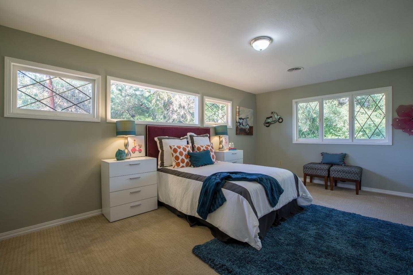 35 Selby Lane Atherton, CA 94027 - Photo 20 of 30 a bed room with a bed and a chair