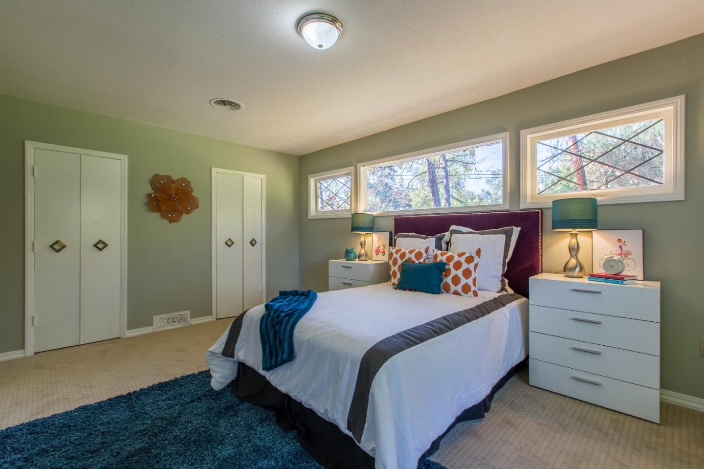 35 Selby Lane Atherton, CA 94027 - Photo 21 of 30 a bedroom with a bed and window